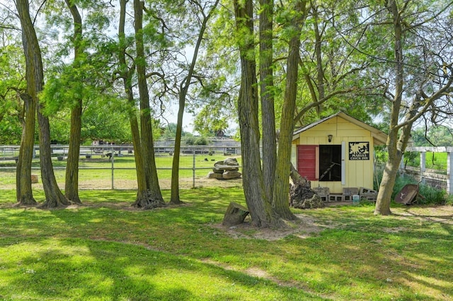 10240 Kost Rd, Galt, CA 95632 - view of yard featuring a storage shed, fence, and an outdoor structure