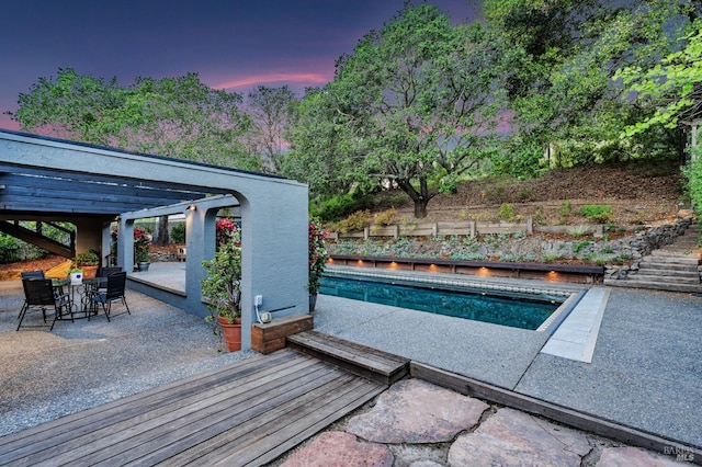 1433 Nye St, San Rafael, CA 94901 - pool at dusk featuring a patio, outdoor dining space, and fence