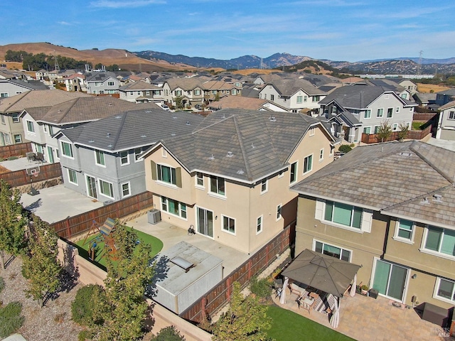drone / aerial view featuring a mountain view and a residential view