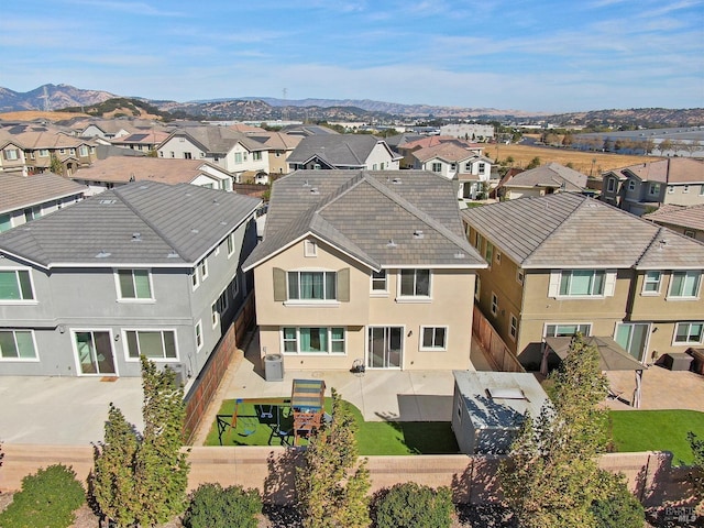 aerial view featuring a mountain view and a residential view