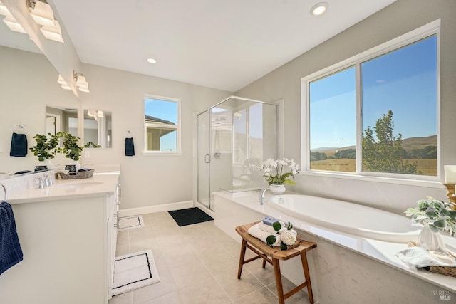 bathroom with a garden tub, tile patterned floors, a stall shower, vanity, and recessed lighting