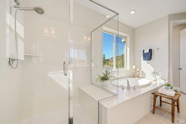 bathroom featuring a bath, tile patterned floors, recessed lighting, and a shower stall