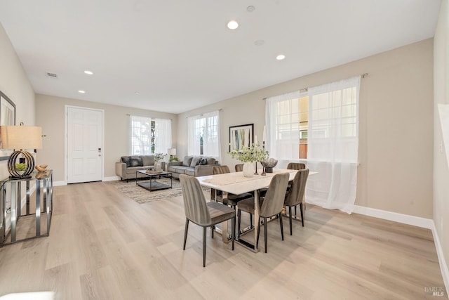 dining room featuring recessed lighting, baseboards, visible vents, and light wood-type flooring