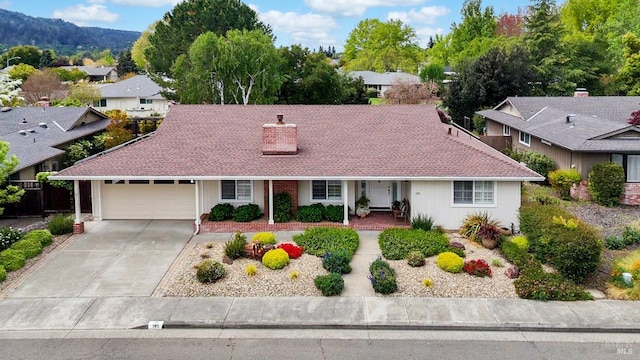 195 Mountain Vista Pl, Santa Rosa, CA 95409 - view of front of home featuring a chimney, concrete driveway, a residential view, and an attached garage