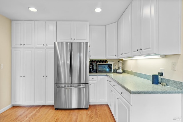 195 Mountain Vista Pl, Santa Rosa, CA 95409 - kitchen with appliances with stainless steel finishes, light wood finished floors, light countertops, white cabinetry, and recessed lighting