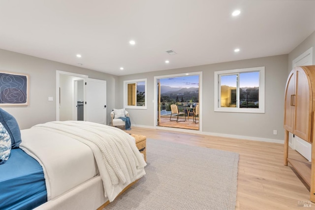 bedroom featuring recessed lighting, access to exterior, visible vents, and light wood-style floors