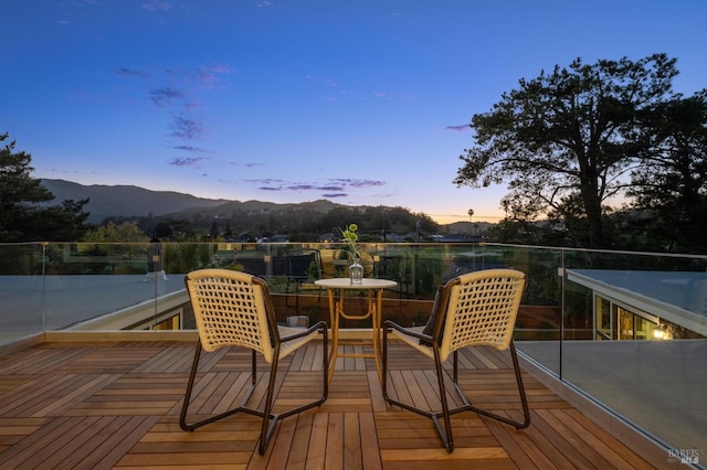 wooden terrace featuring a mountain view