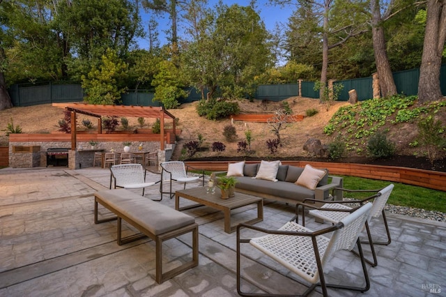 view of patio / terrace featuring area for grilling, outdoor lounge area, and a fenced backyard