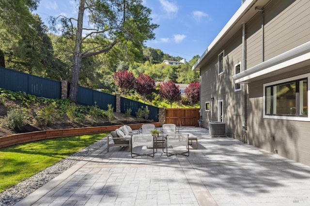 view of patio / terrace with an outdoor hangout area, a fenced backyard, and central AC unit