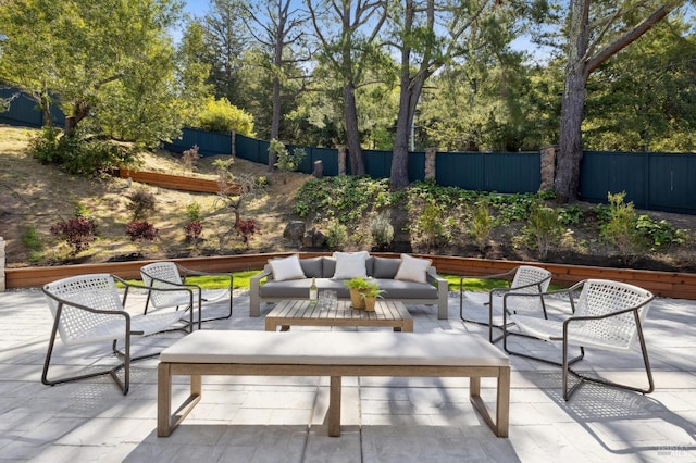 view of patio / terrace featuring fence and an outdoor living space