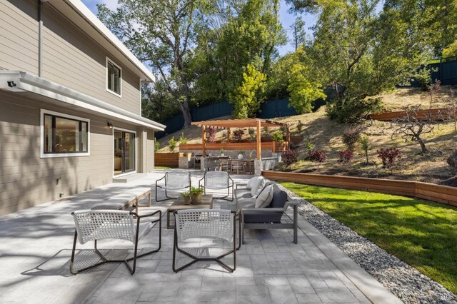 view of patio / terrace featuring fence and outdoor dry bar