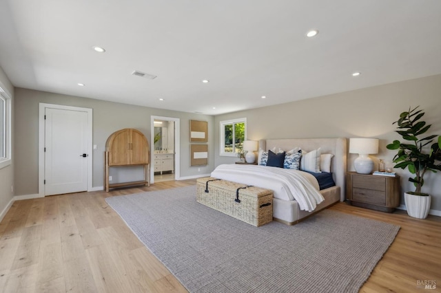 bedroom featuring baseboards, visible vents, light wood finished floors, and recessed lighting