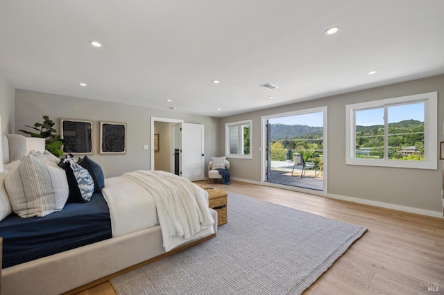 bedroom with recessed lighting, light wood-style flooring, access to outside, and baseboards