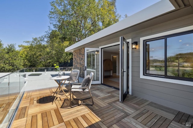 wooden deck with outdoor dining area