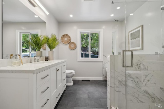 bathroom featuring recessed lighting, vanity, toilet, a marble finish shower, and baseboards