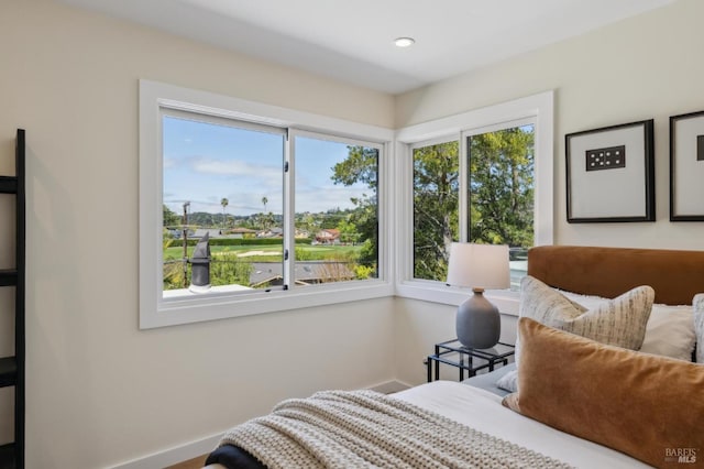 bedroom featuring baseboards and recessed lighting