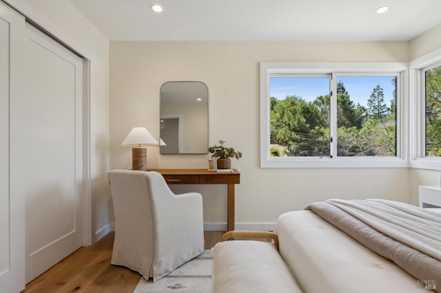 bedroom featuring recessed lighting, wood finished floors, and baseboards