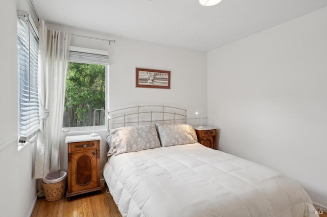 bedroom featuring wood finished floors