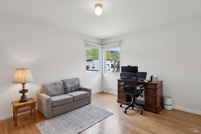office area featuring wood finished floors and baseboards