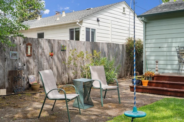 view of patio / terrace featuring fence