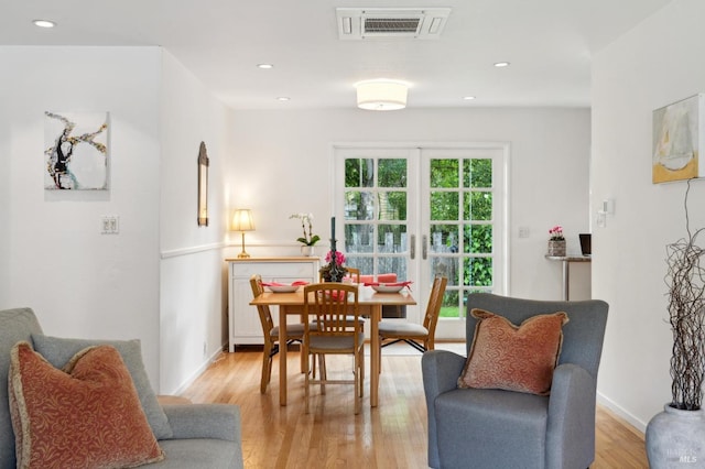 dining area with french doors, light wood finished floors, baseboards, visible vents, and recessed lighting