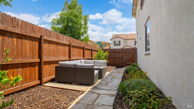 2350 White Dr, Fairfield, CA 94533 - fenced backyard with outdoor lounge area, a patio, and a gate