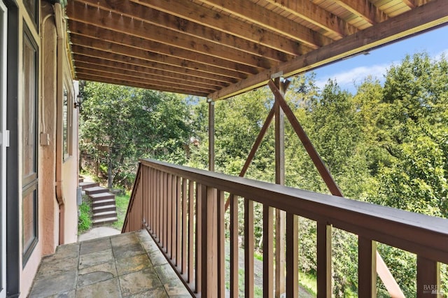 balcony featuring stairway