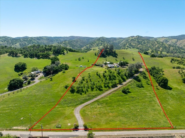 birds eye view of property with a rural view and a mountain view