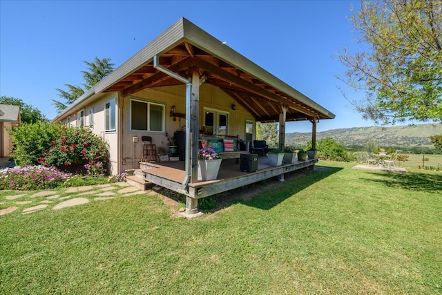 exterior space with a lawn and a deck