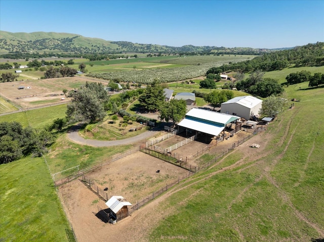 bird's eye view featuring a mountain view and a rural view