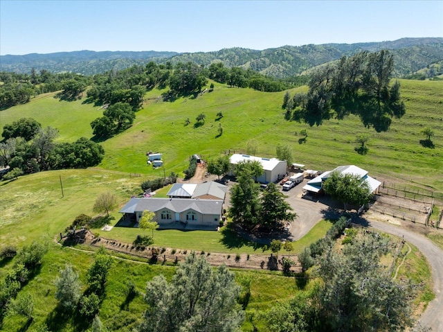 birds eye view of property with a rural view and a mountain view