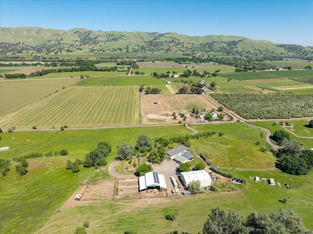 birds eye view of property with a rural view and a mountain view