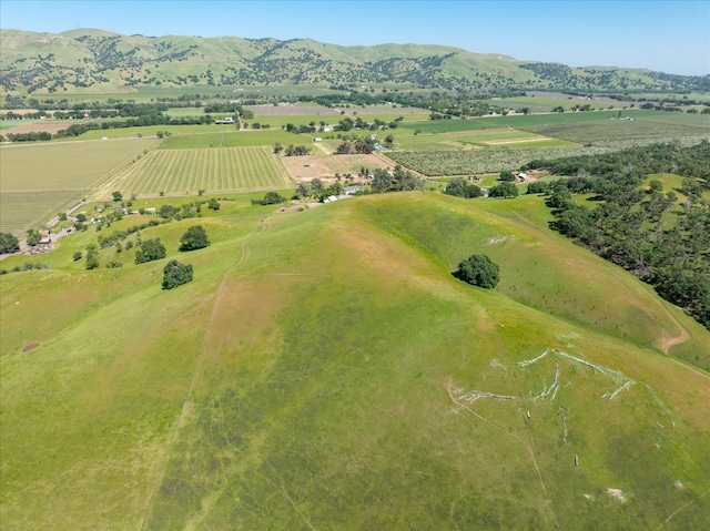 drone / aerial view featuring a rural view and a mountain view