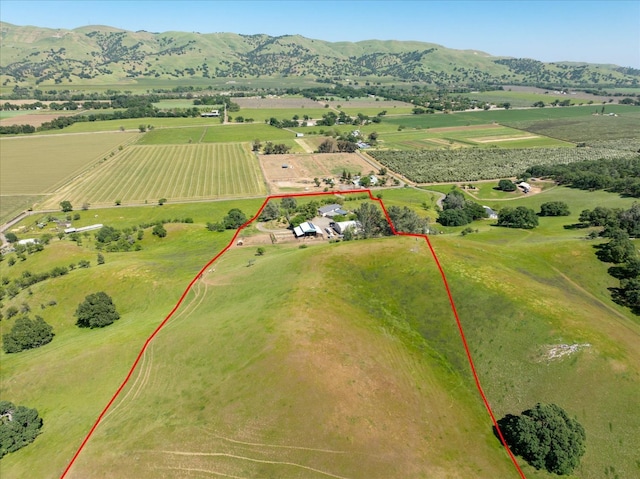 drone / aerial view featuring a rural view and a mountain view
