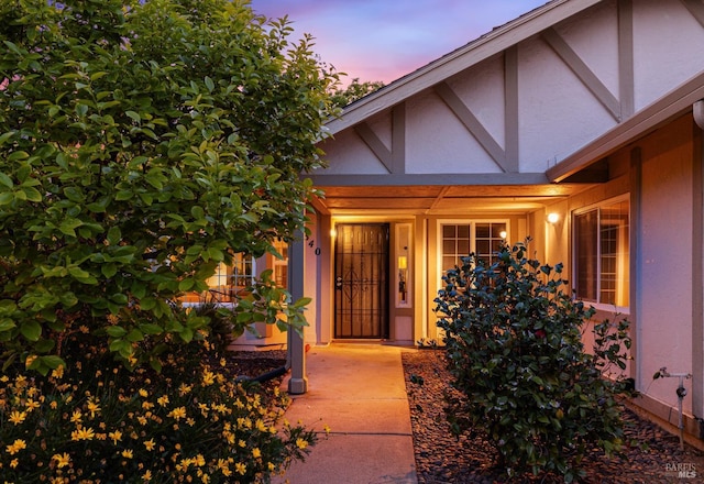 doorway to property with stucco siding