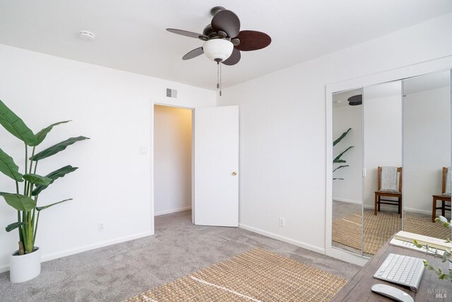 unfurnished bedroom featuring a closet, carpet, visible vents, and baseboards