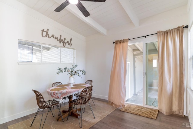 dining area with beamed ceiling, baseboards, a ceiling fan, and wood finished floors