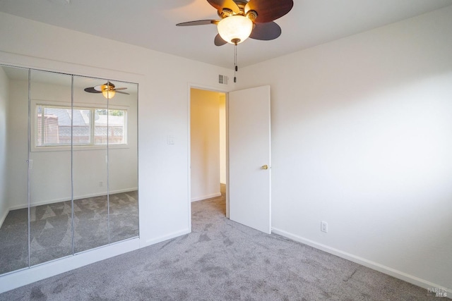 unfurnished bedroom with carpet flooring and baseboards
