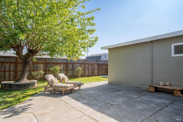 view of patio featuring fence