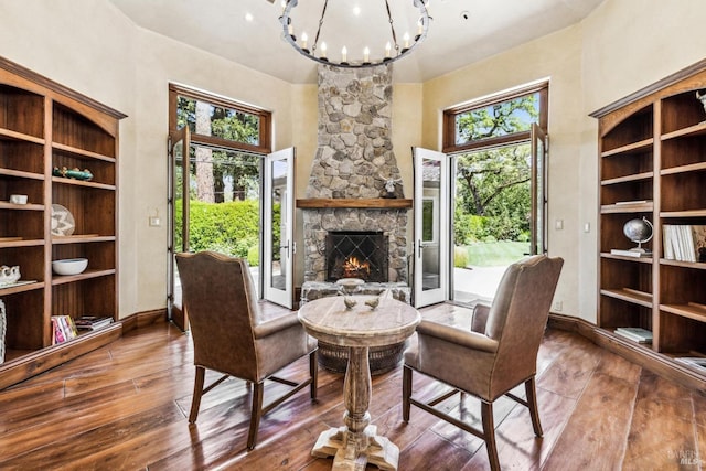 1571 Silver Trl, Napa, CA 94558 - sitting room featuring a wealth of natural light, a fireplace, a notable chandelier, and wood-type flooring