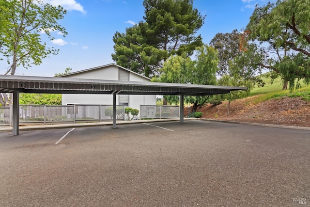 covered parking lot with fence