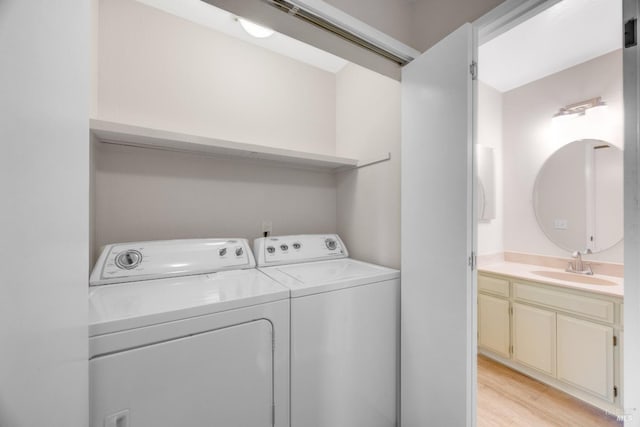 28 Acorn Cir, Petaluma, CA 94952 - washroom with washer and clothes dryer and light wood-style flooring