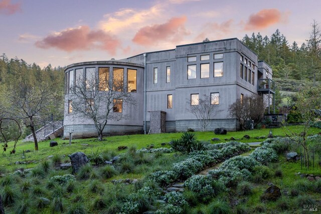 view of property exterior at dusk