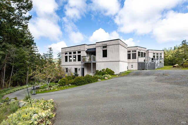 view of property with driveway