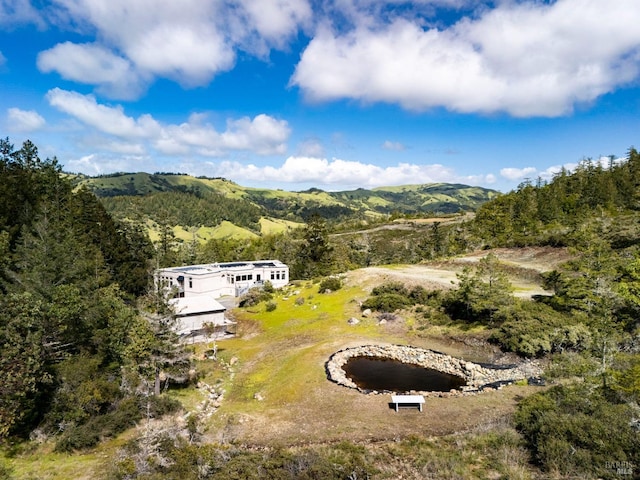 view from above of property with a mountainous background