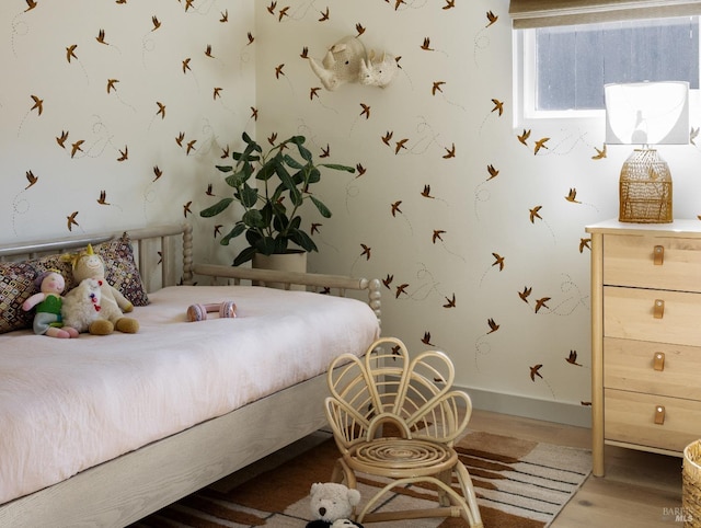 bedroom featuring wood finished floors
