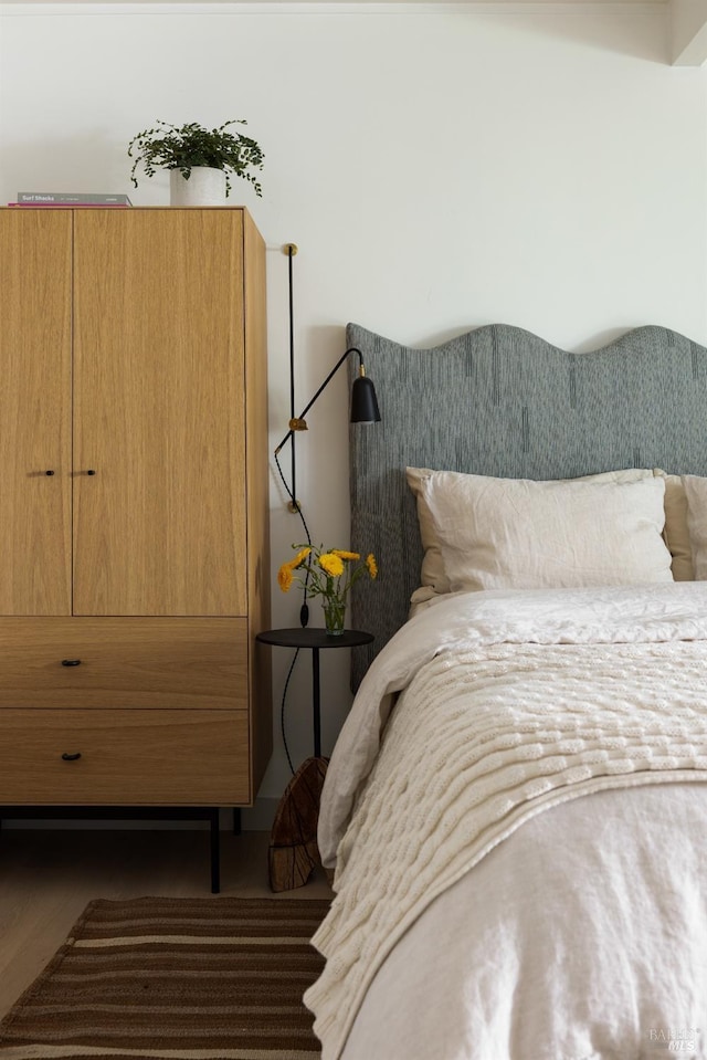 bedroom with wood finished floors