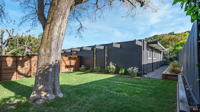 view of yard with a fenced backyard