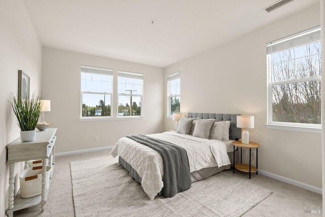 bedroom featuring carpet floors, baseboards, and visible vents