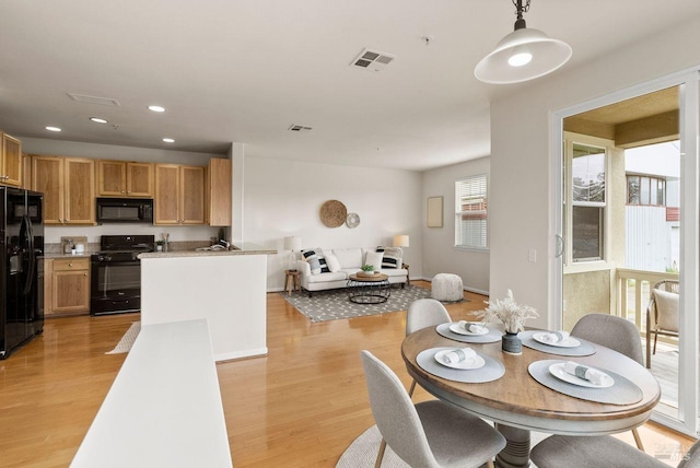 dining space featuring recessed lighting, visible vents, and light wood finished floors